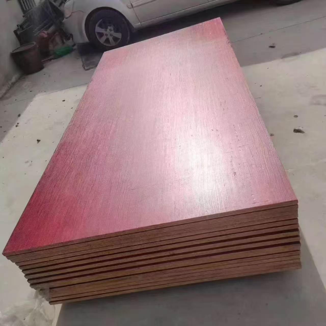Red film-faced plywood floor board